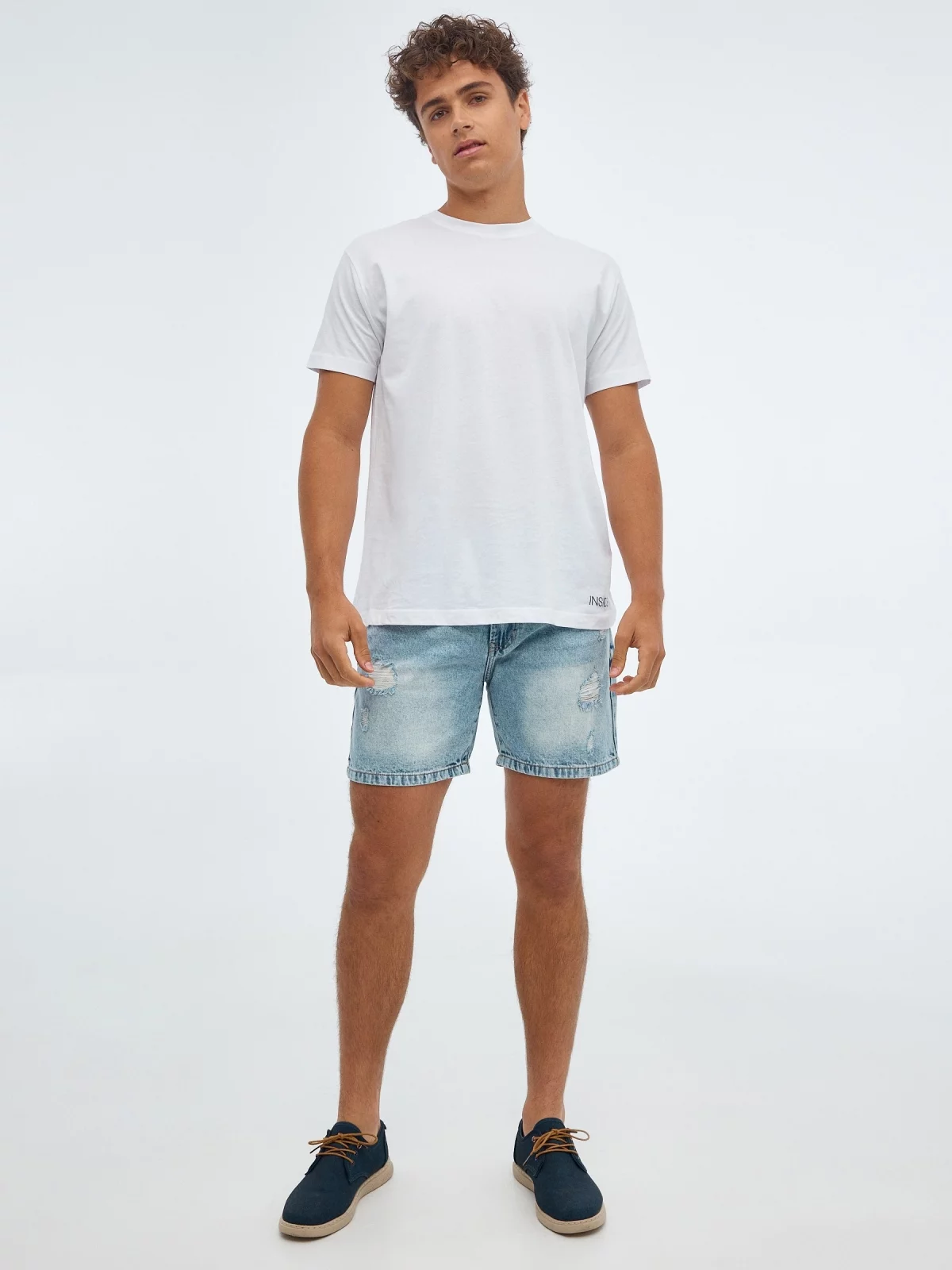 Denim Bermuda shorts with rips blue front view