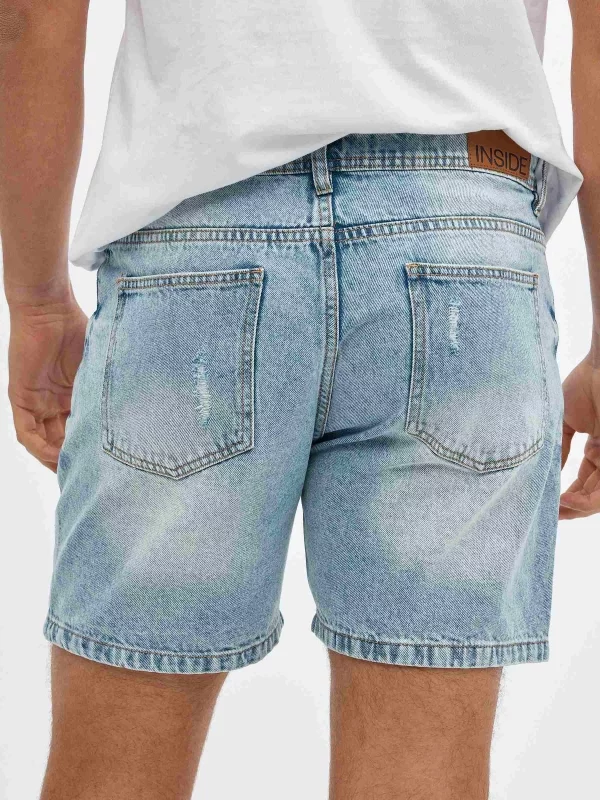 Denim Bermuda shorts with rips blue detail view