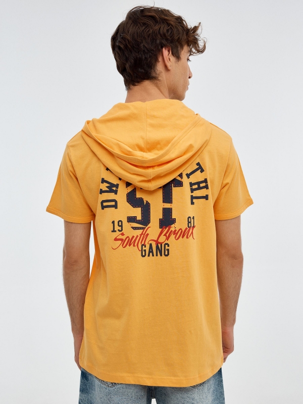 Sports print T-shirt pastel yellow middle back view