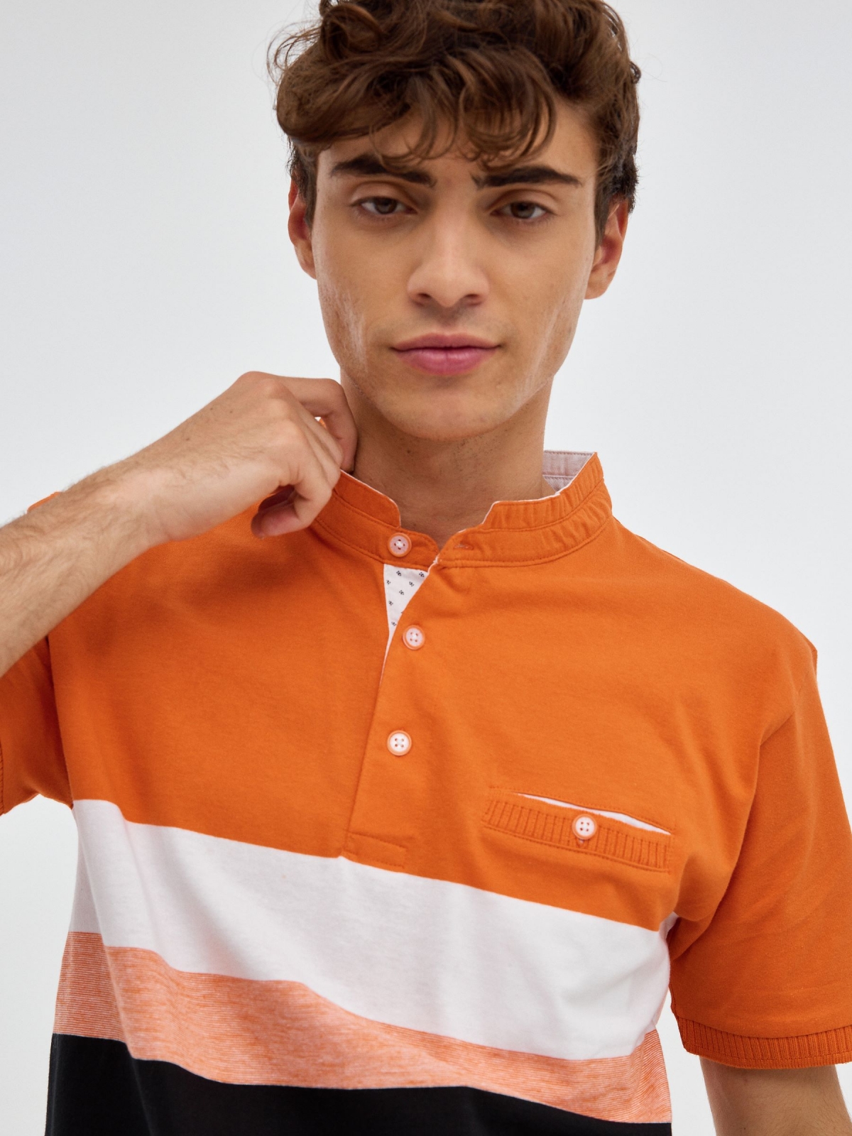 Striped mao polo shirt orange detail view