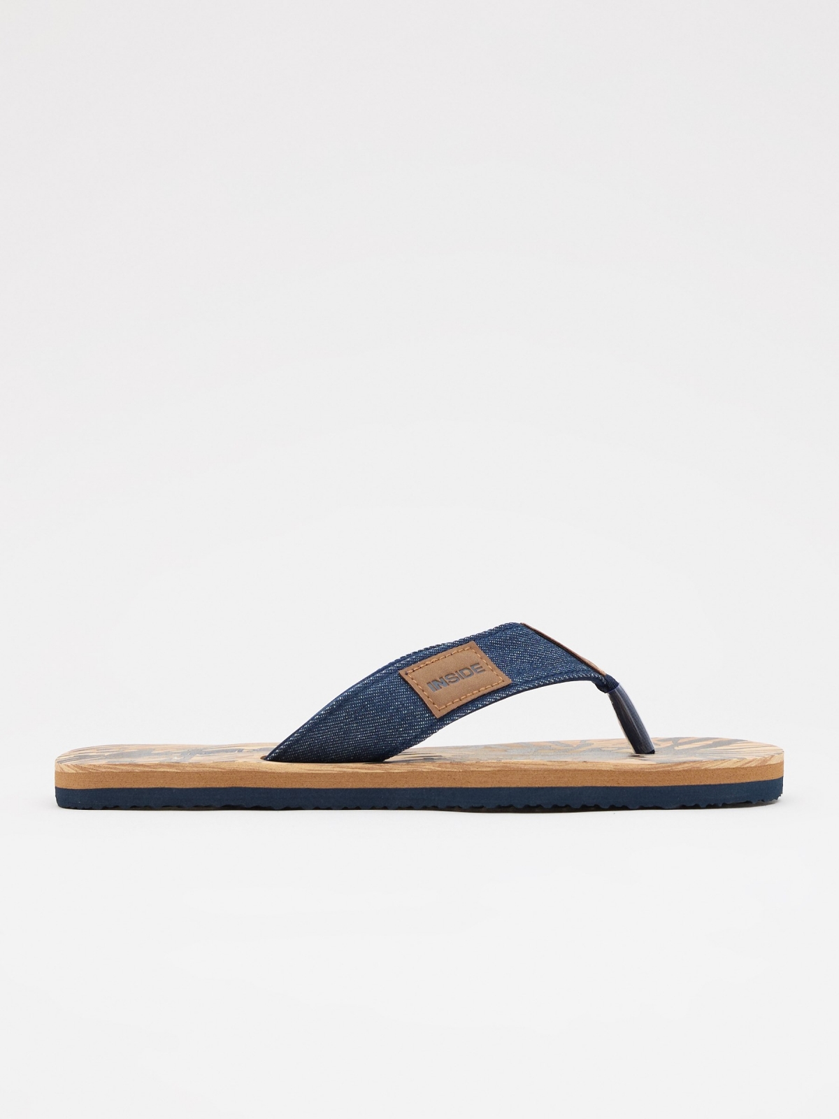 Blue denim thong sandal sand lateral view