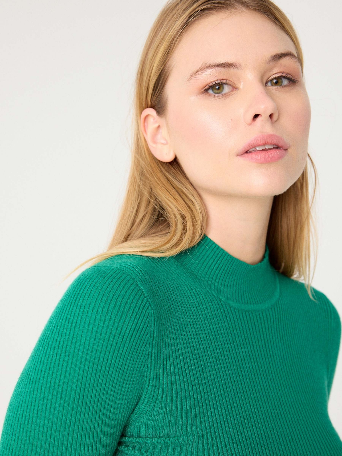 Black sweater with turtleneck green detail view