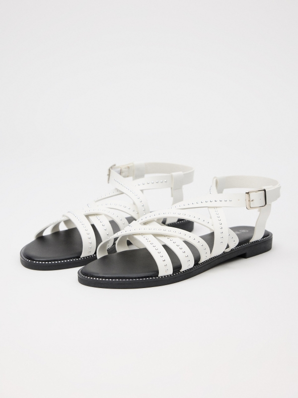Sandal with crossed straps and studs white 45º front view