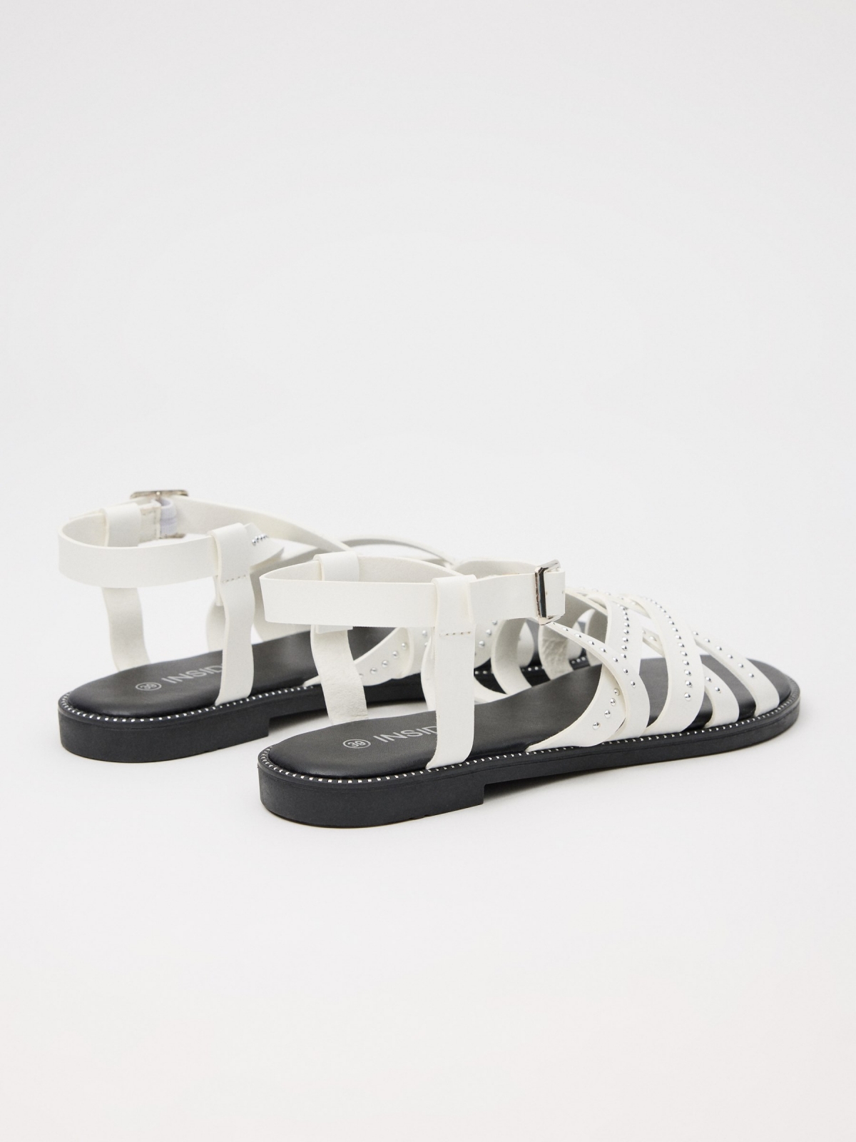 Sandal with crossed straps and studs white 45º back view