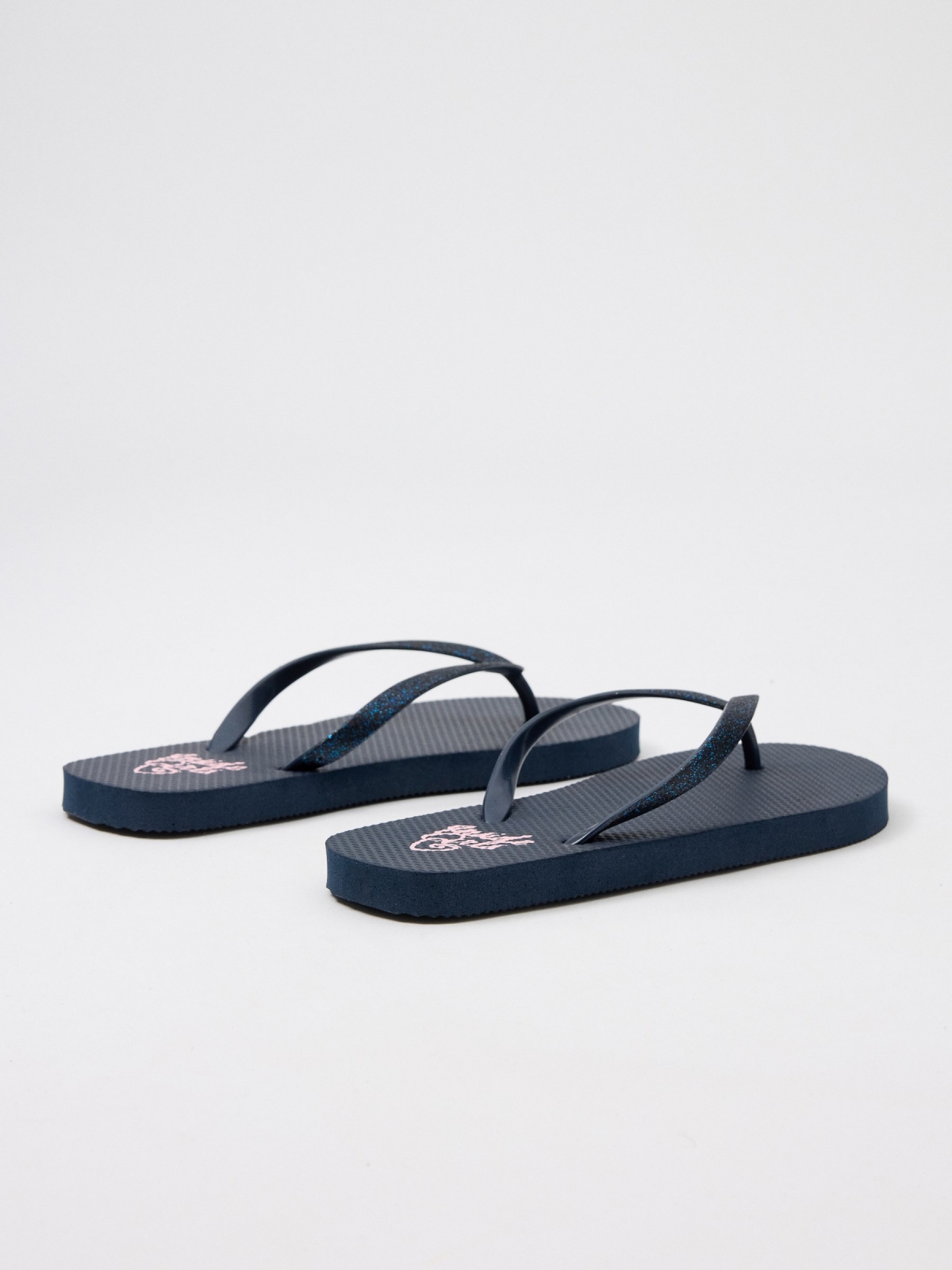 Beach flip flops with shiny straps navy 45º back view