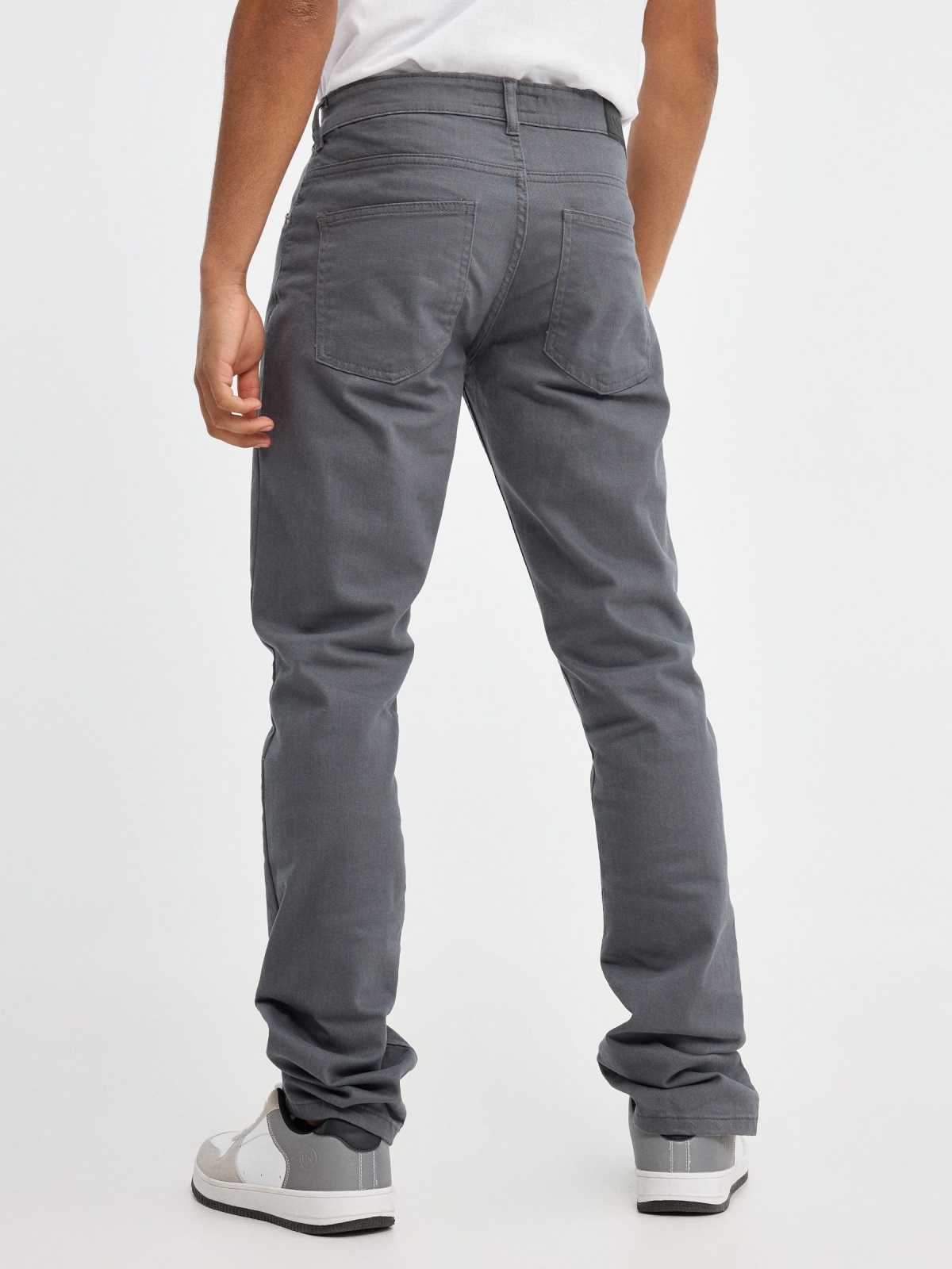 Coloured slim jeans grey middle back view