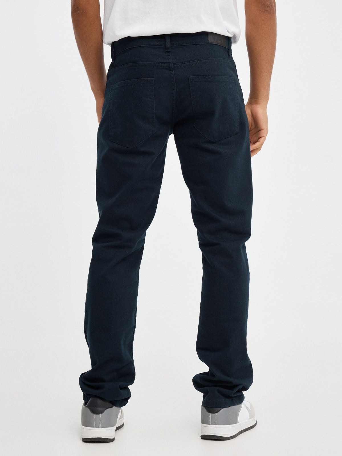 Basic colored jeans blue middle back view