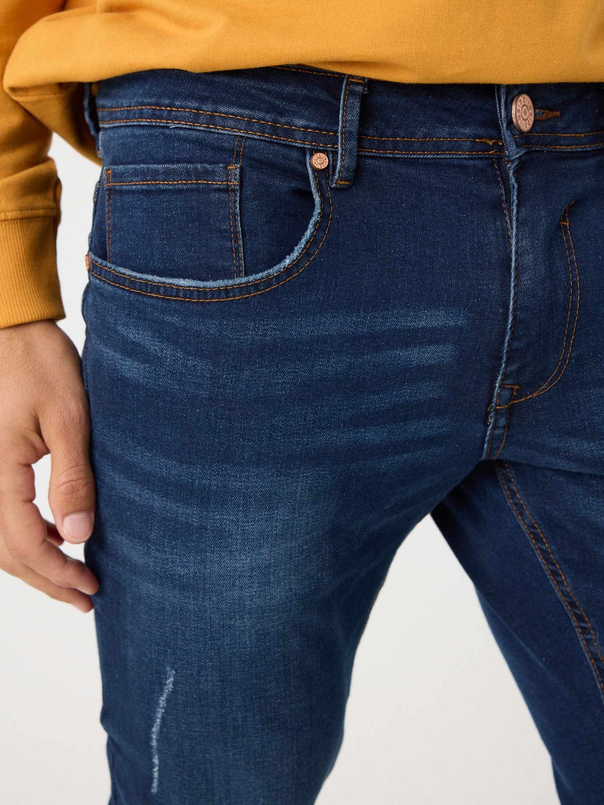 Dark denim slim jeans blue detail view