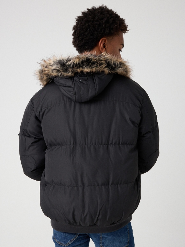 Quilted coat with fur hood black middle back view