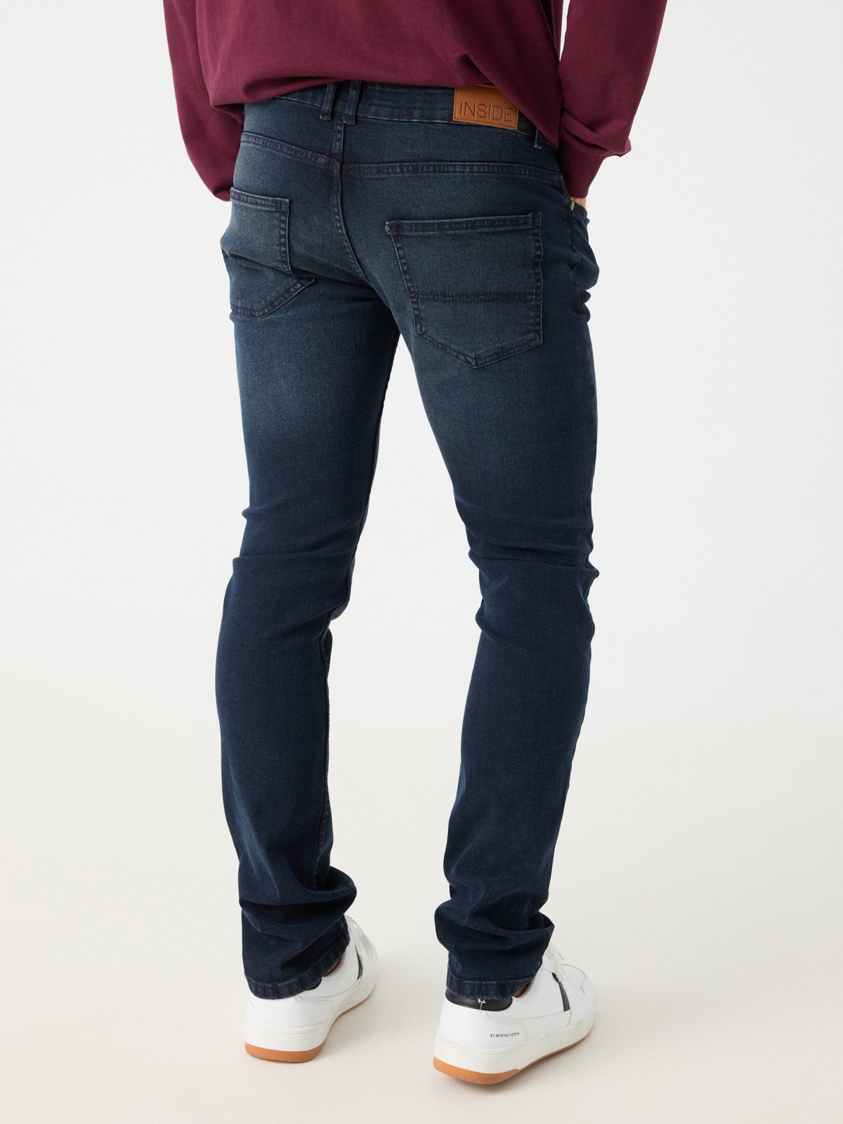 Navy blue slim jeans dark blue middle back view