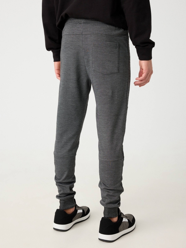 Jogger pants with zippers black middle back view