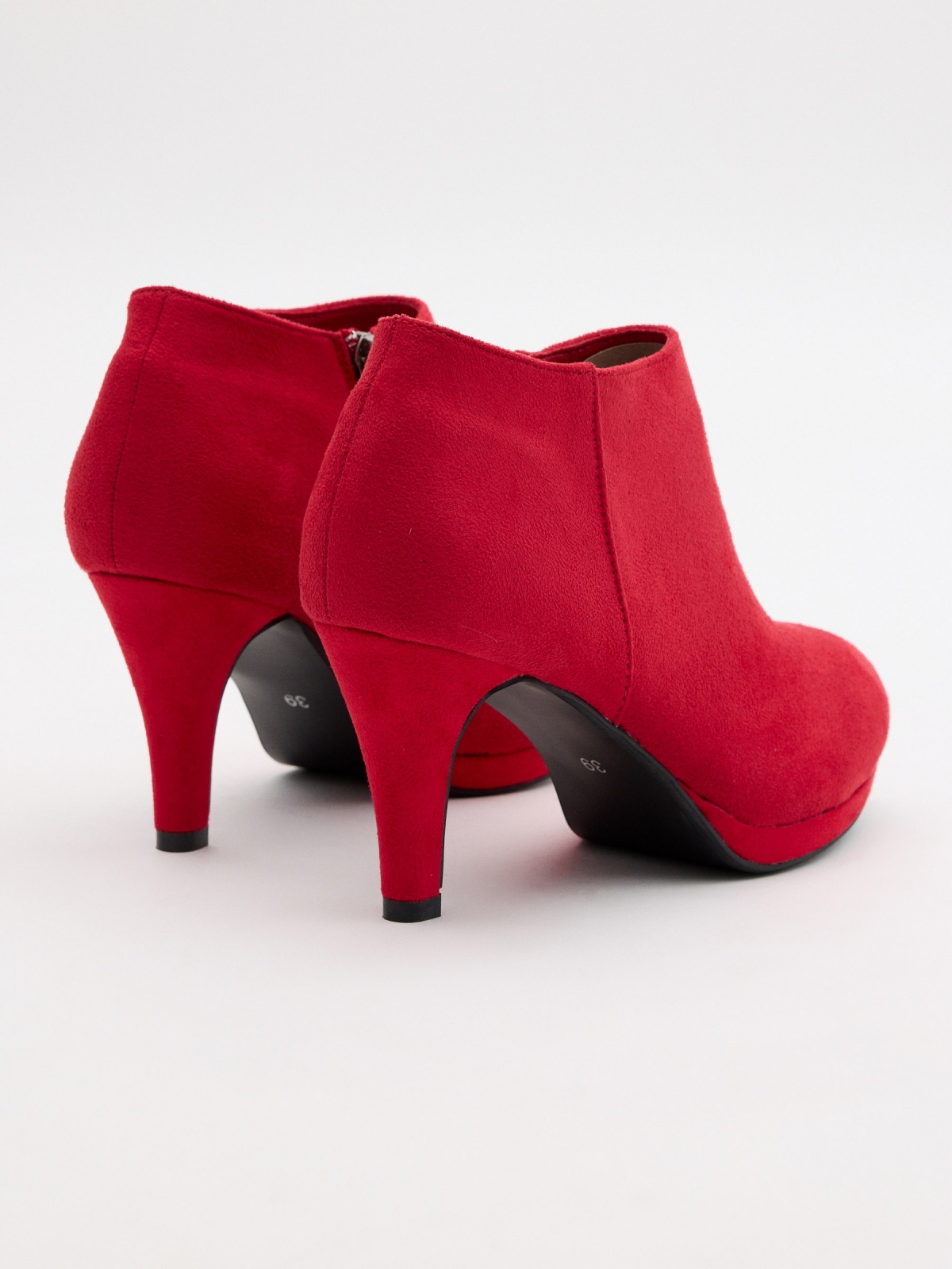Red suede heeled pumps red 45º back view