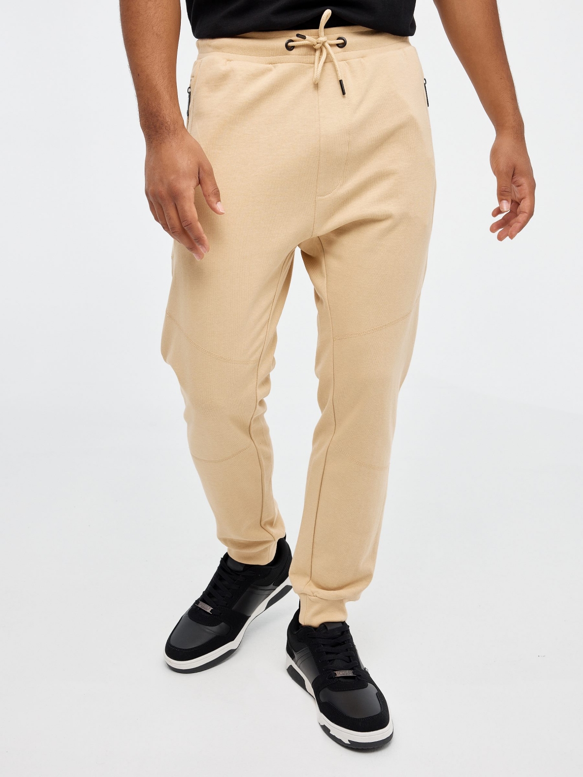 Jogger pants with pockets sand middle front view