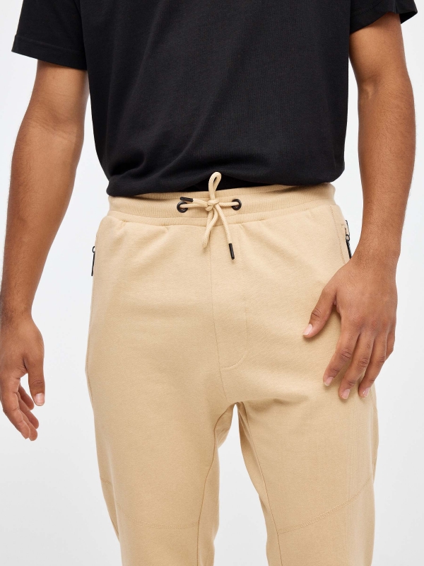 Jogger pants with pockets sand detail view