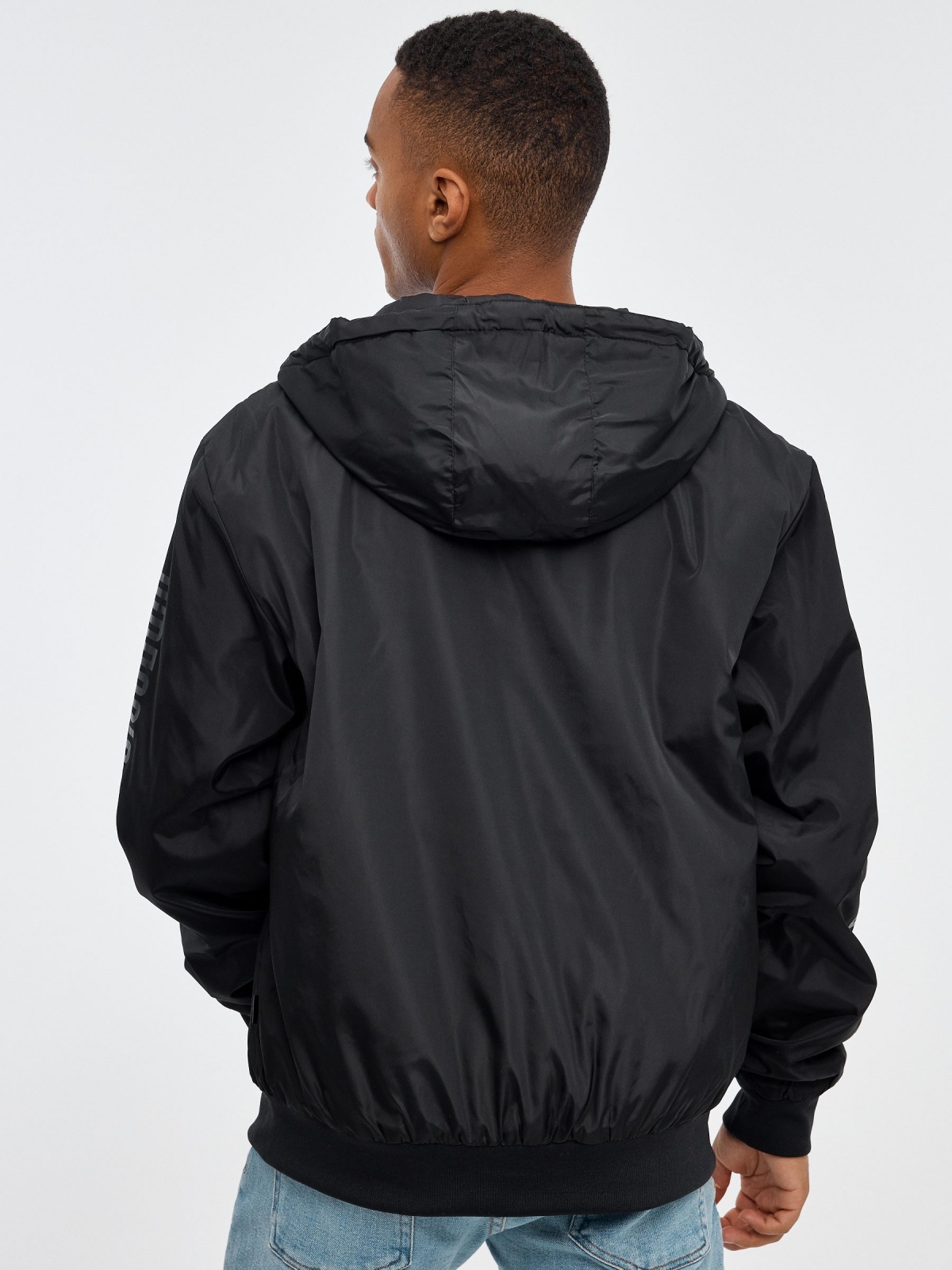 Nylon jacket with hood black middle back view