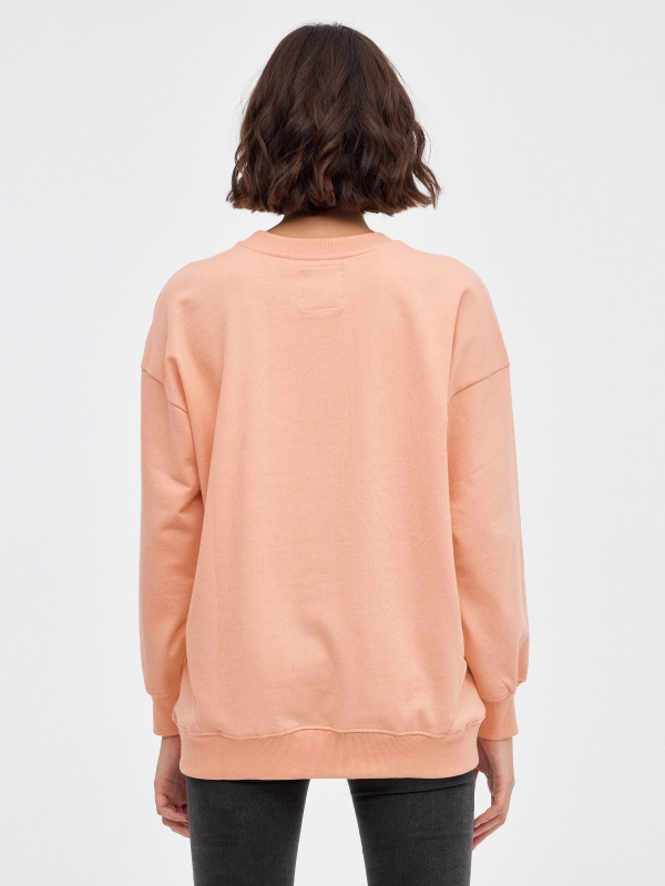 Graphic oversized sweatshirt peach middle back view