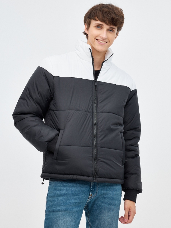 Block color quilted jacket black middle front view