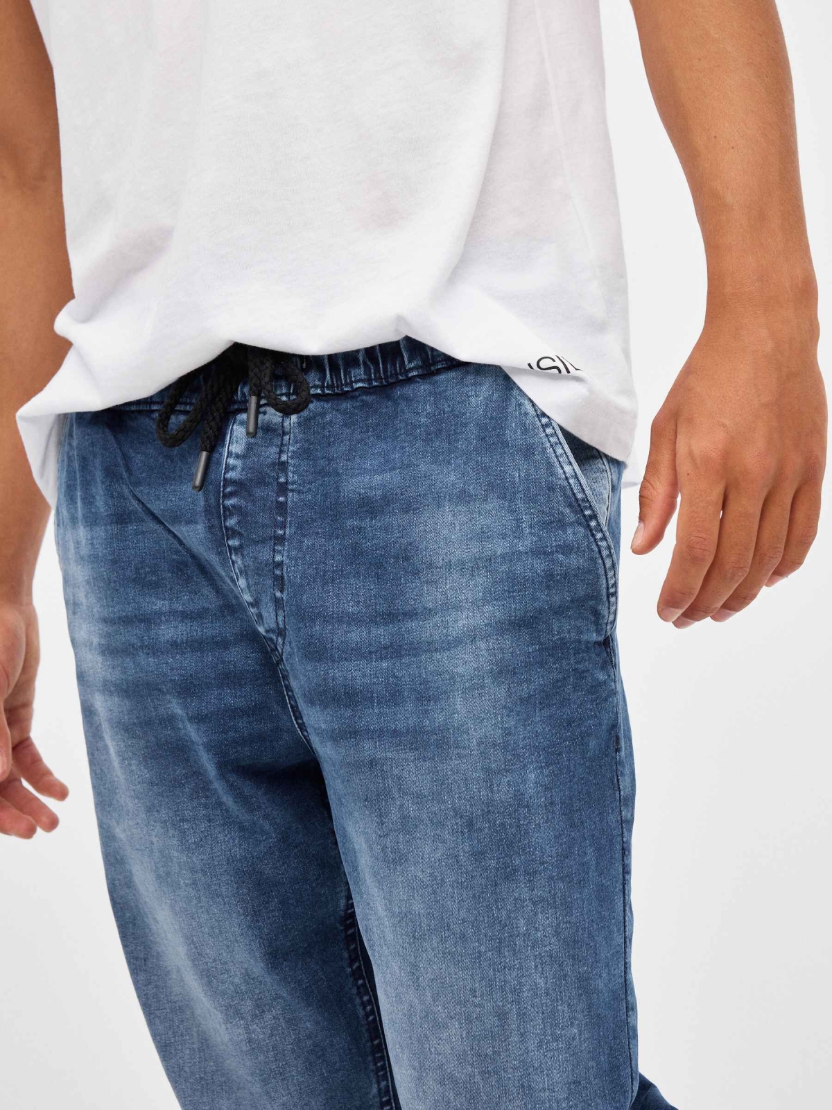 Denim jogger pants with rips blue detail view