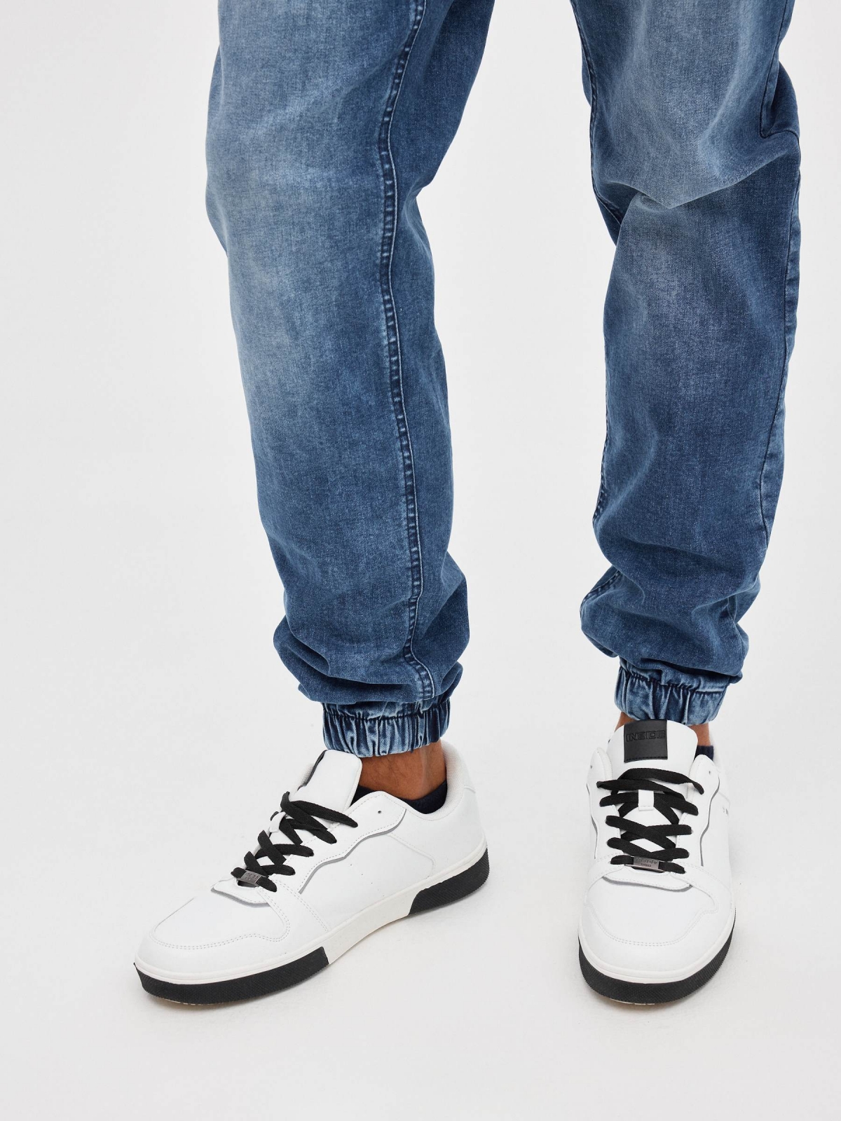 Denim jogger pants with rips blue detail view