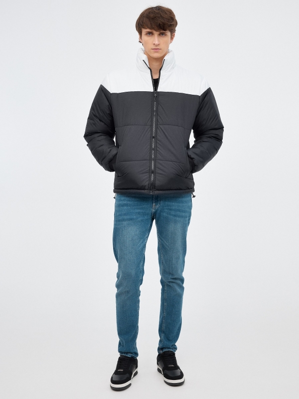 Block color quilted jacket black front view