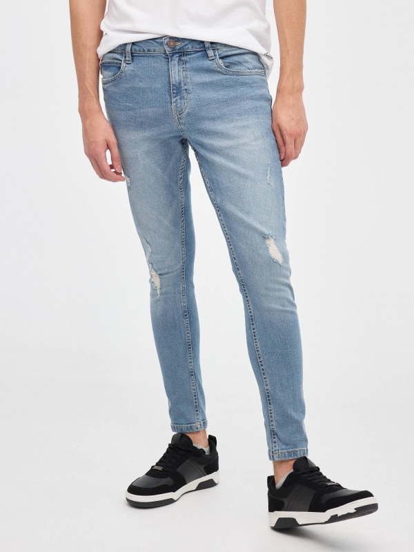 Ripped denim skinny jeans blue middle front view