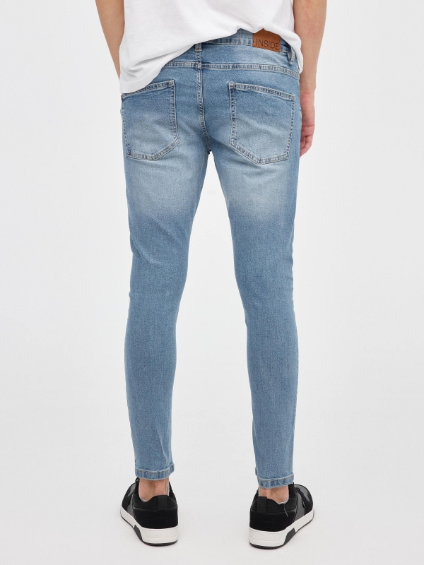 Jeans skinny denim rotos azul vista media trasera