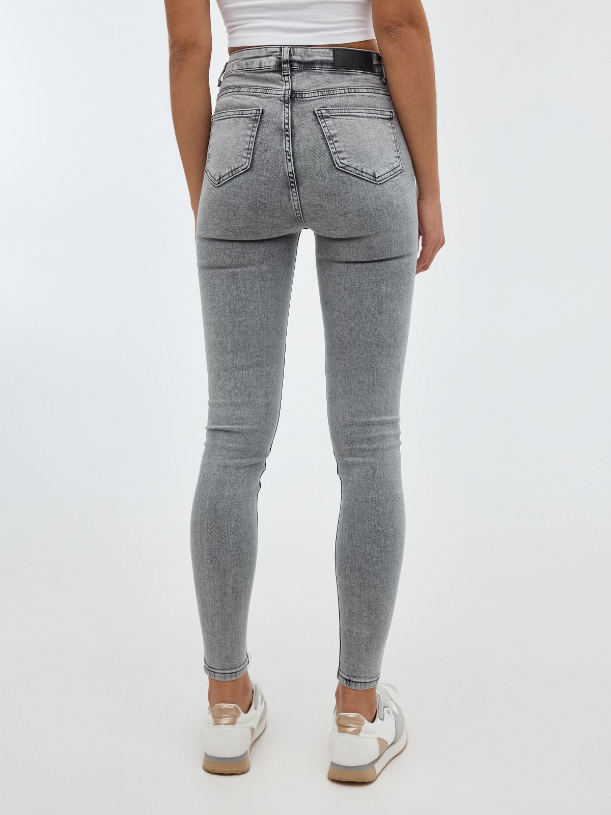 Grey skinny jeans medium grey middle back view