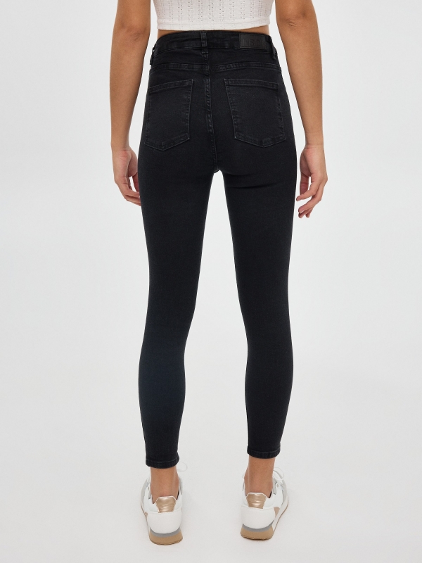 High rise skinny jeans black middle back view