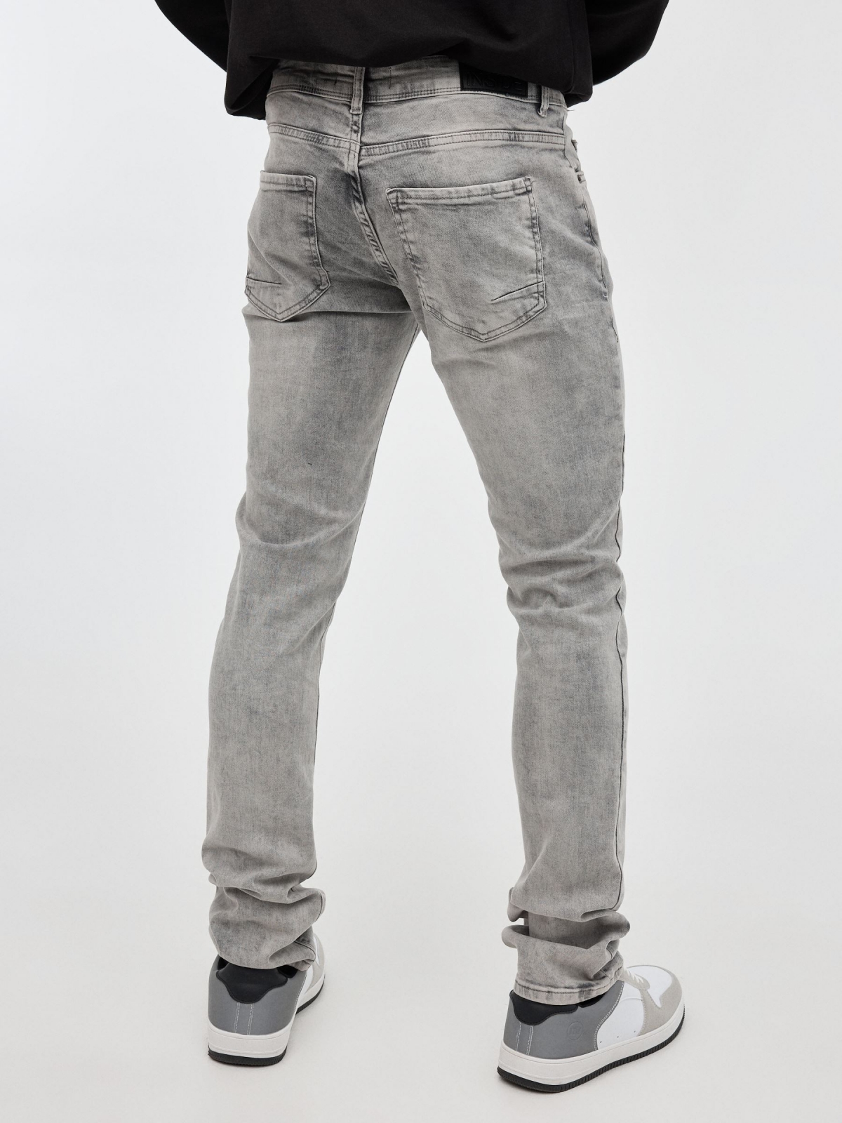 Light gray slim jeans grey middle back view
