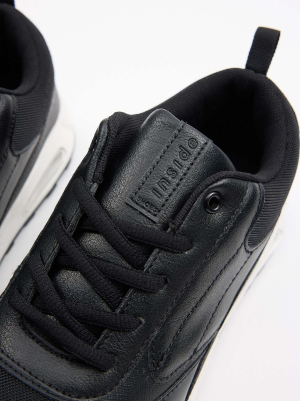 Black sneaker with air chamber black detail view