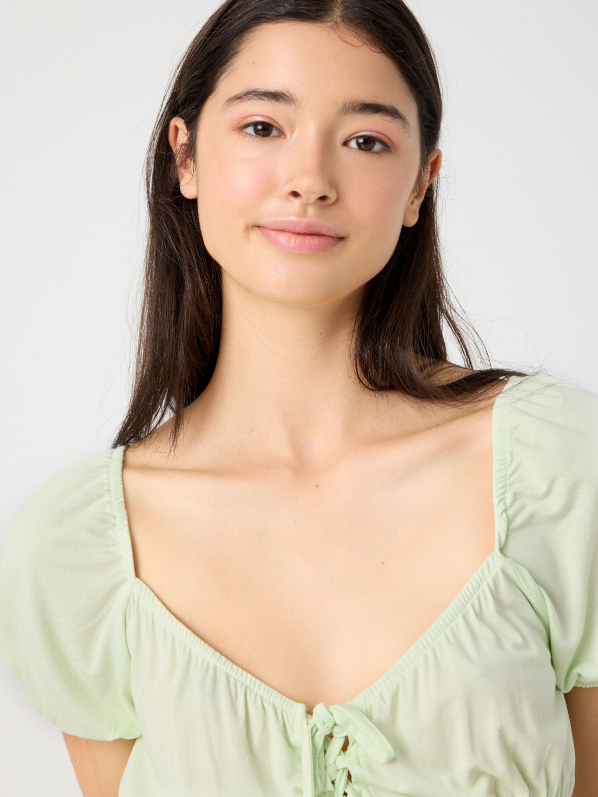 Lace up ruffle cropped t-shirt light green front view