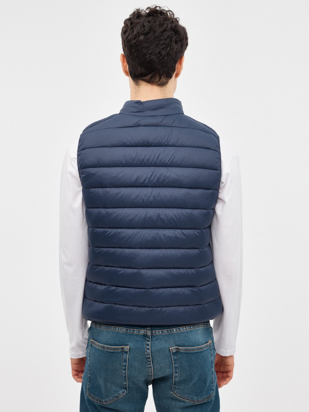 Quilted vest with graphic blue middle back view