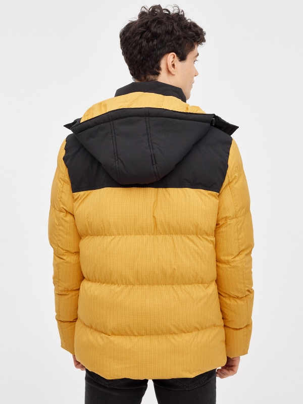Block color quilted coat yellow middle back view