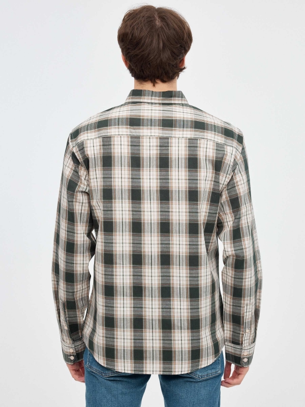 Green checkered shirt beige middle back view