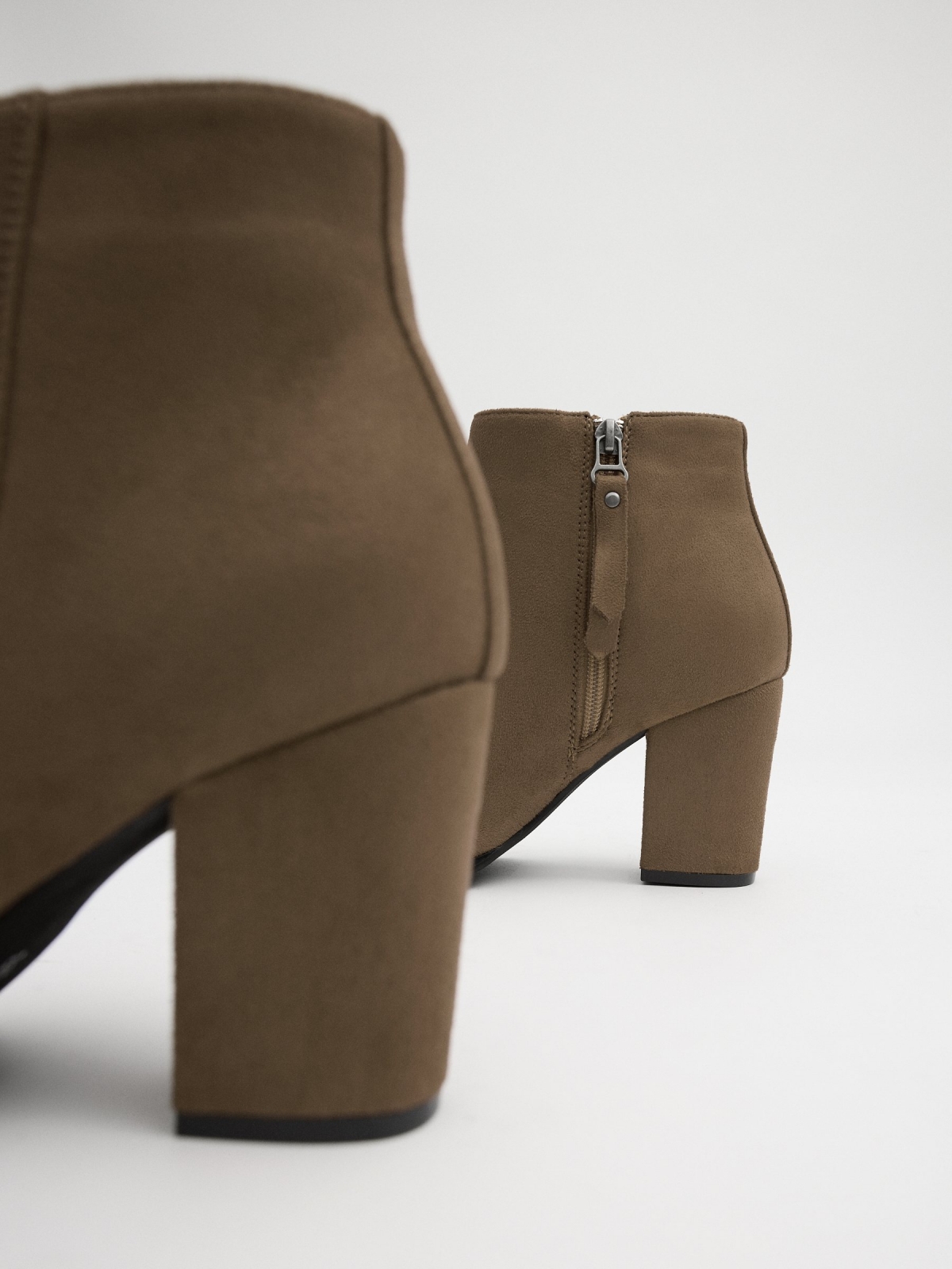 Brown ankle boot with heel beige detail view