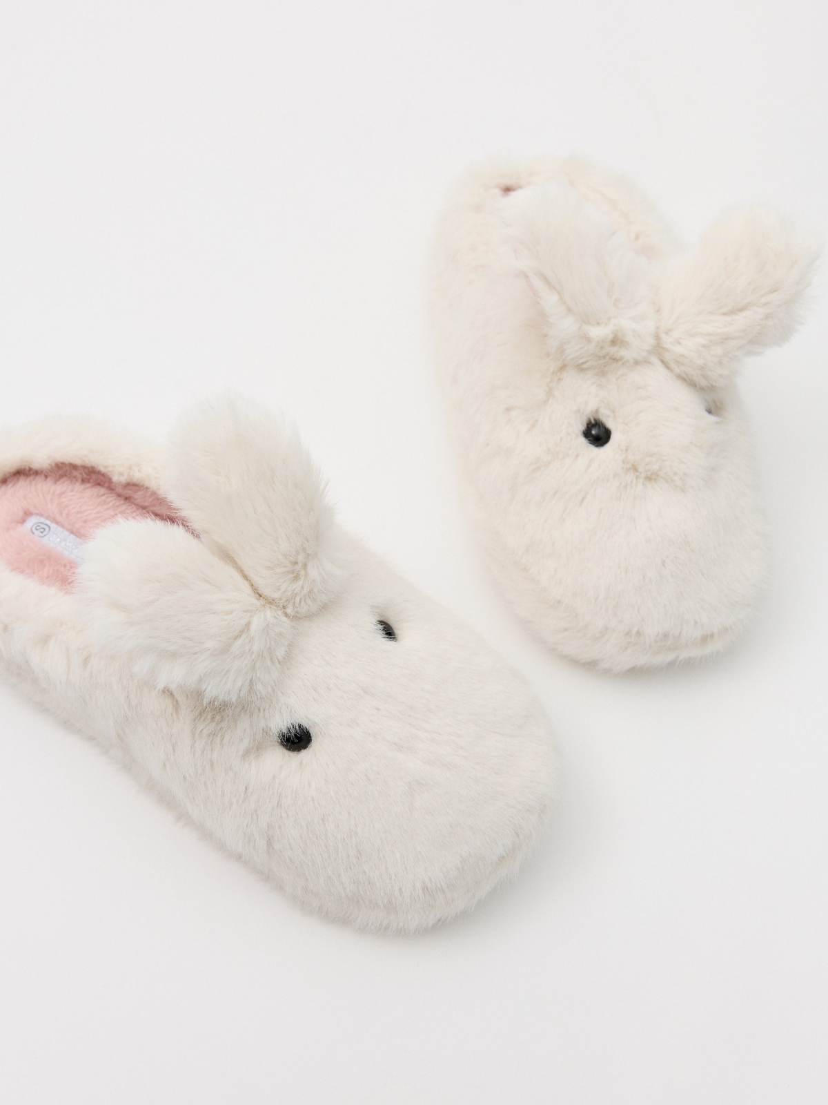 Zapatillas de casa orejas conejo blanco roto vista detalle