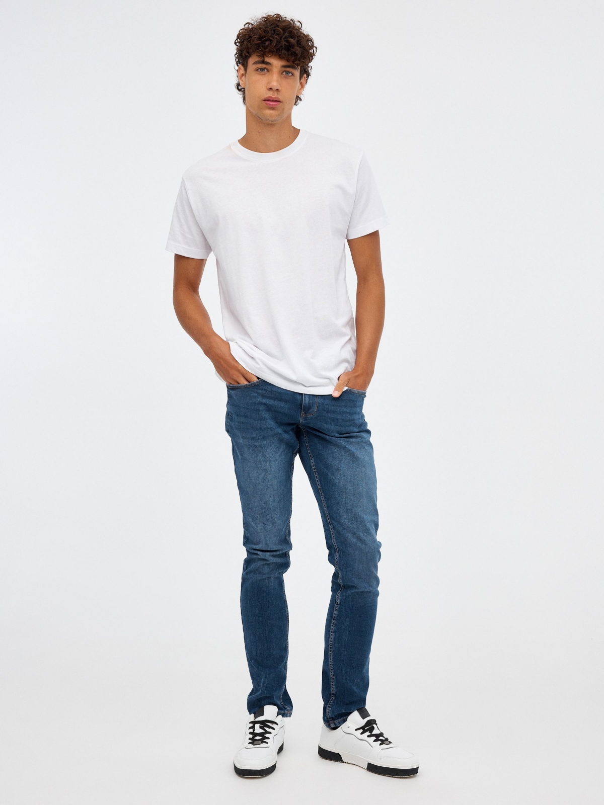 Mid rise slim denim jeans blue front view