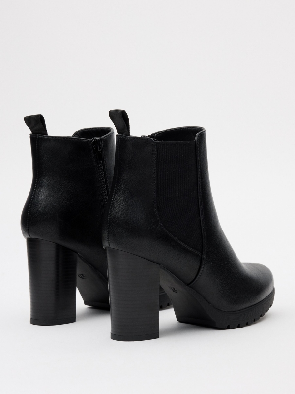 Rubber heeled ankle boots black 45º back view