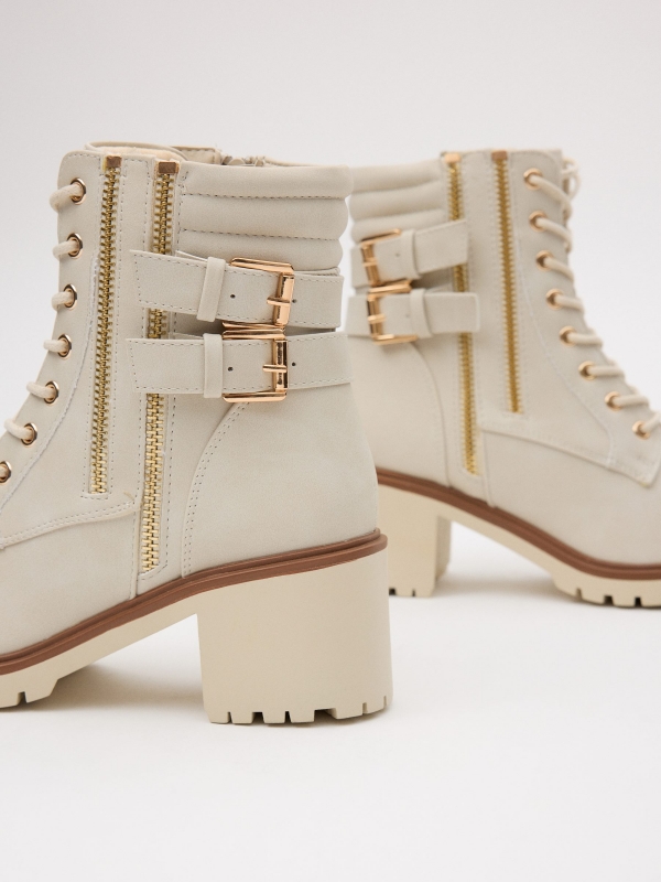 Ankle boots with double buckle heel detail view