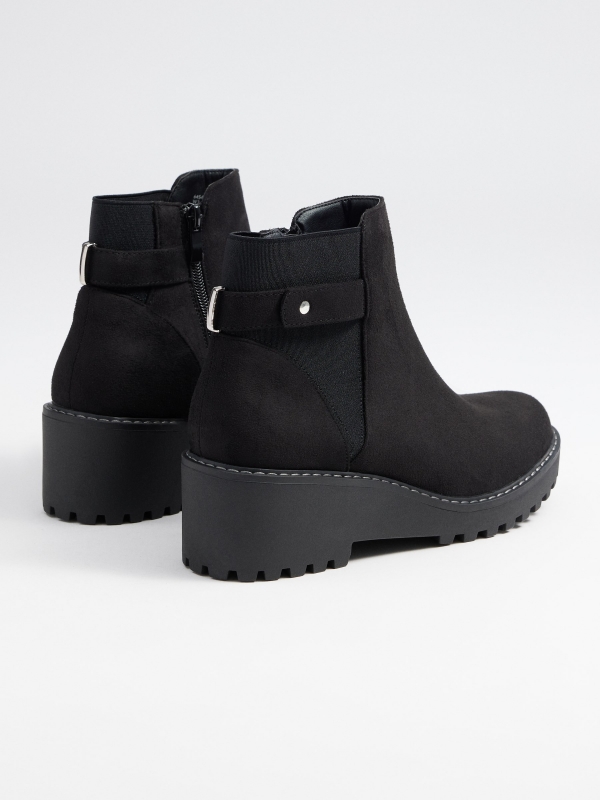 Wedge and buckle boots 45º back view