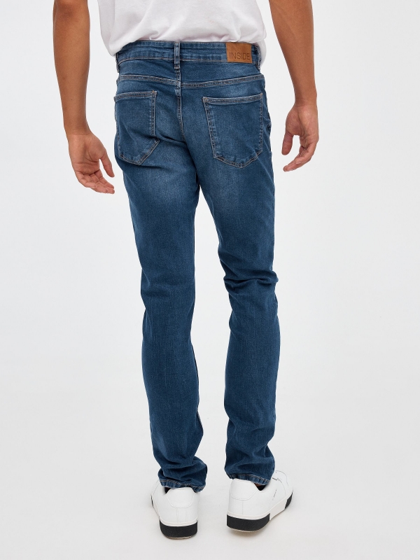 Mid rise slim denim jeans blue middle back view