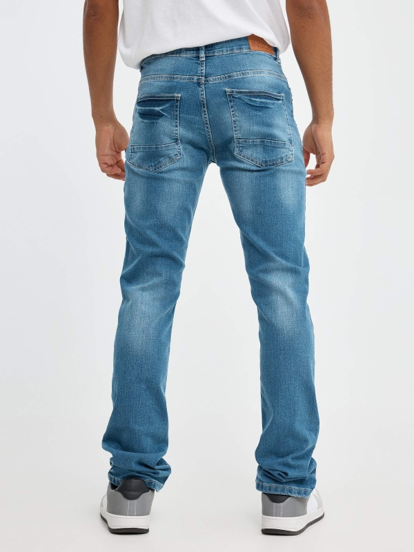 Jeans de ganga azuis básicas azul vista meia traseira