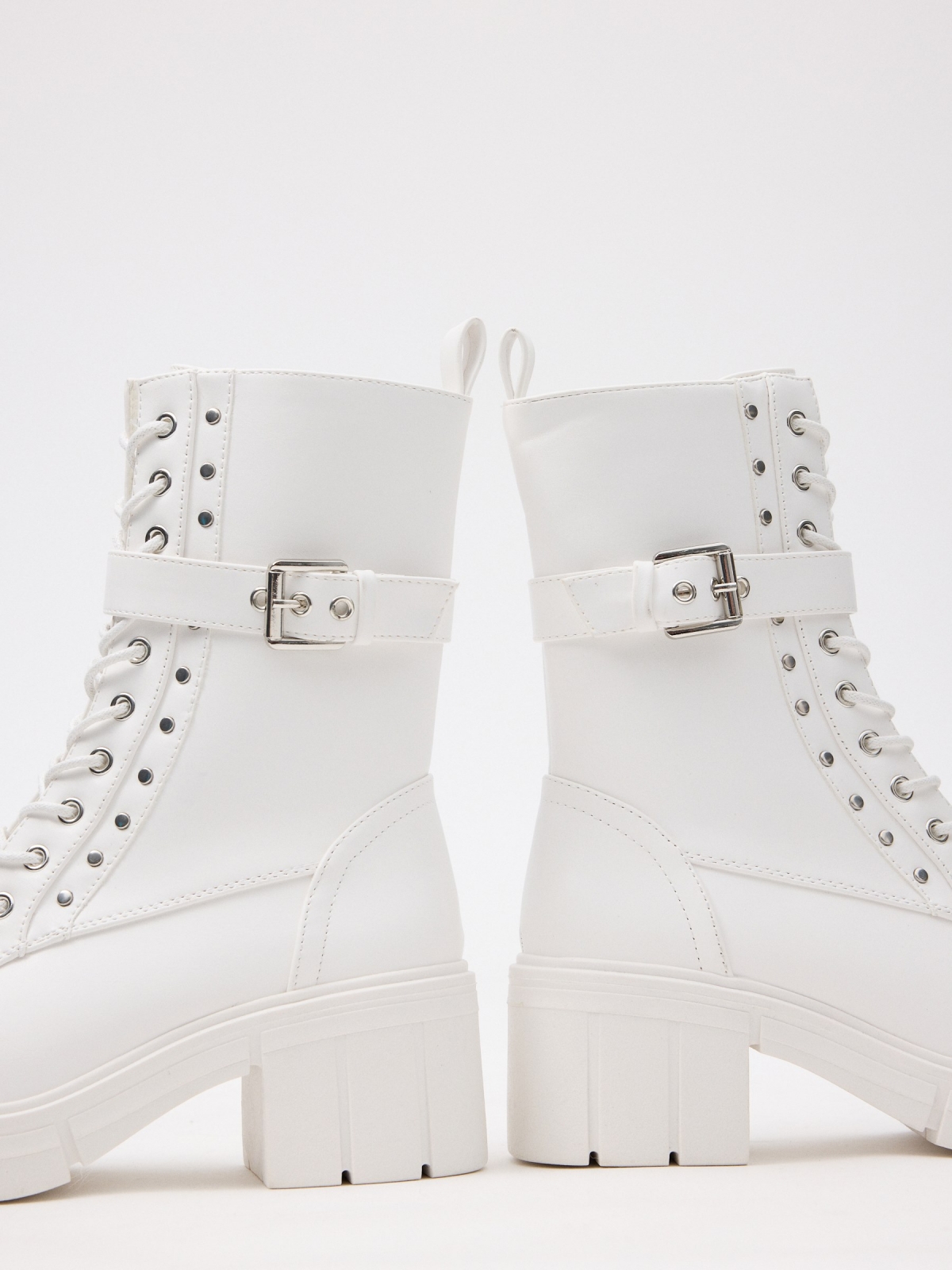 Ankle boots with buckle and studs white detail view