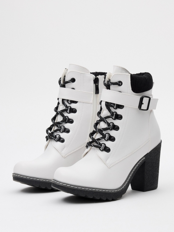 Black and white leatherette ankle boots white 45º front view