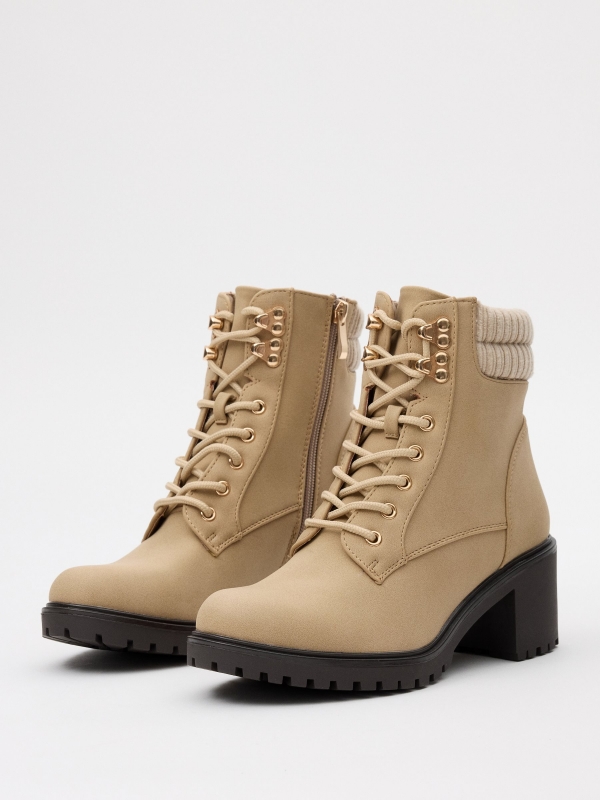 Ankle boots with buckle and collar beige 45º front view
