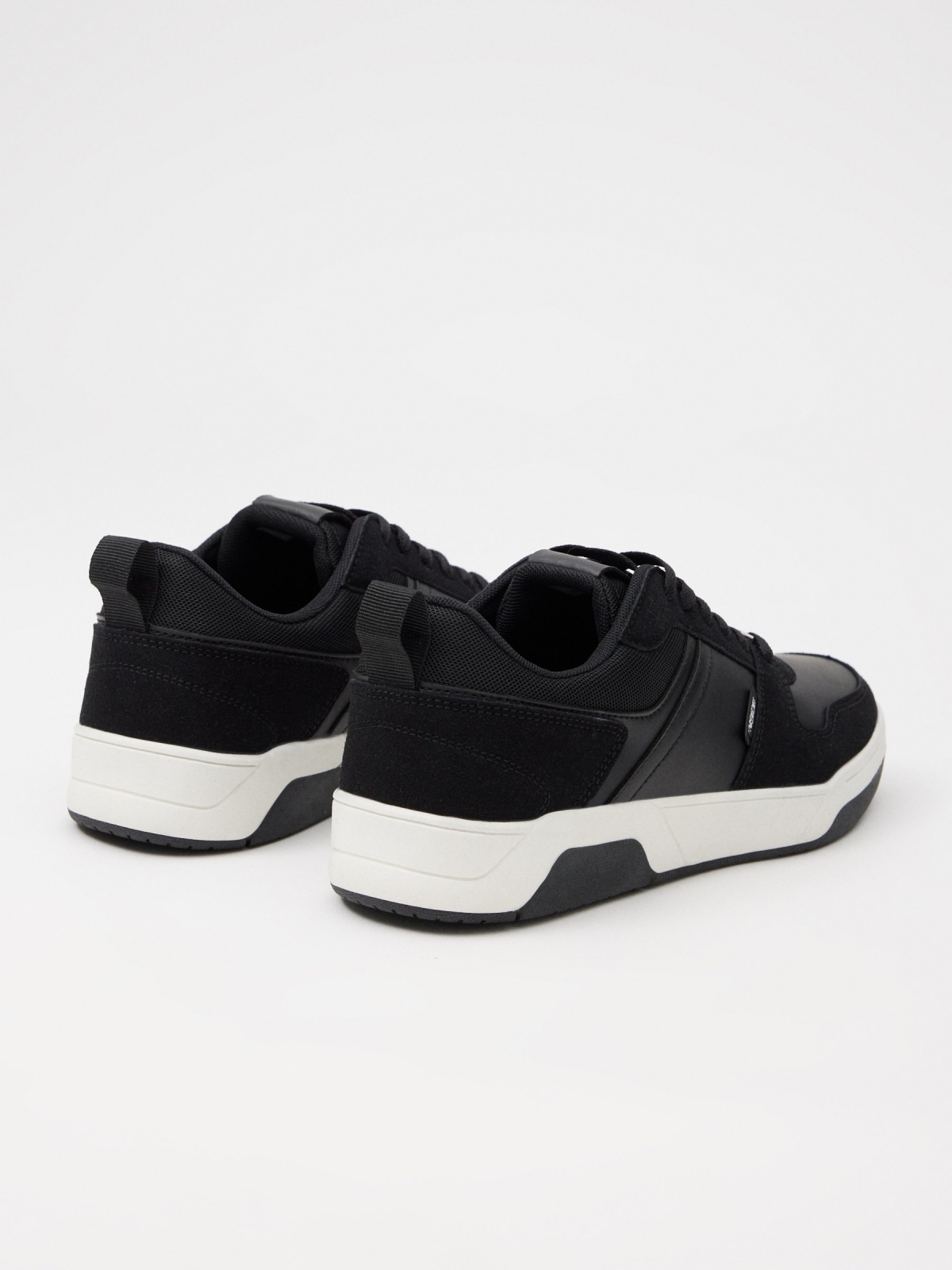 Skater and patent leather sneaker black 45º back view