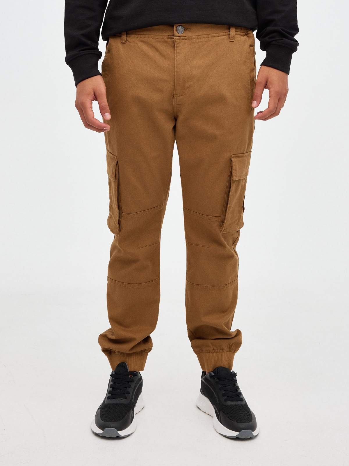 Jogger pants with pocket legs beige middle front view