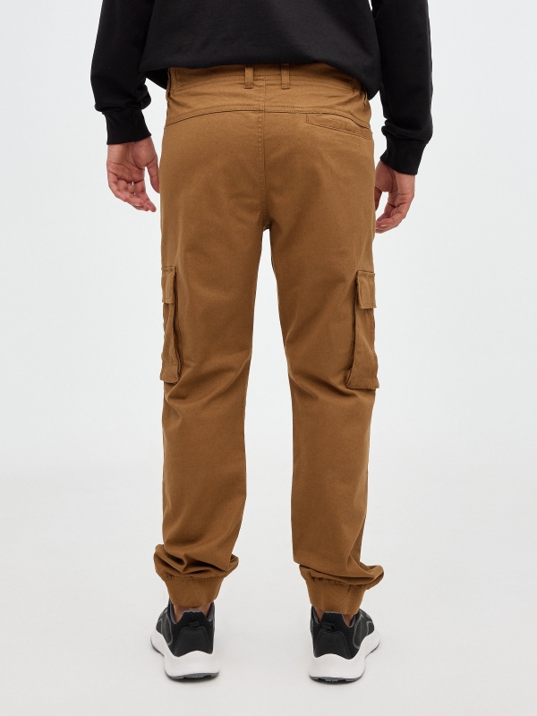 Jogger pants with pocket legs beige middle back view