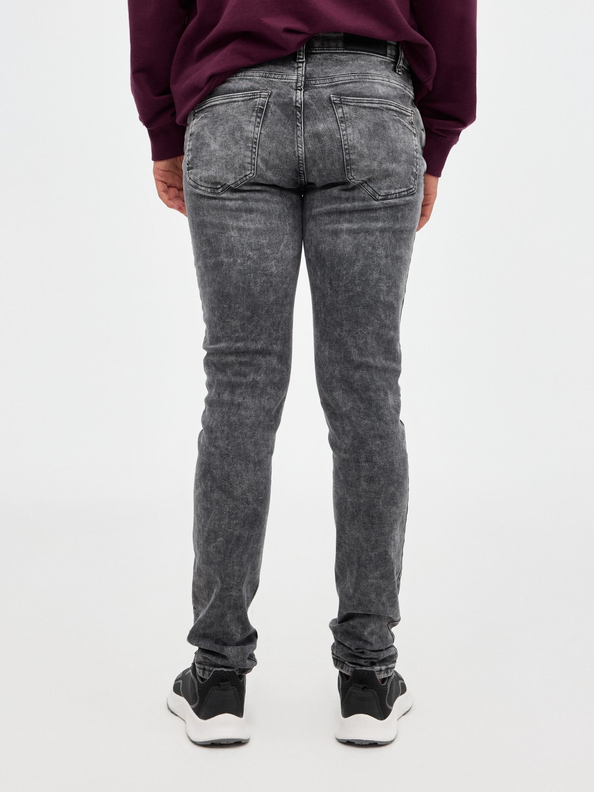 Jeans super slim rotos gris vista media trasera