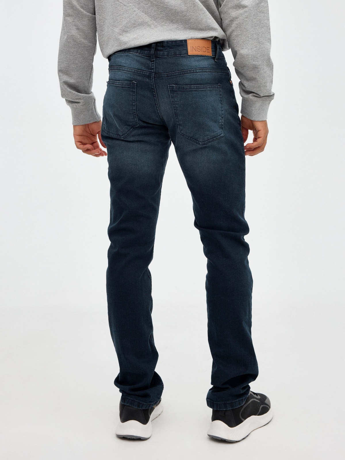 Dark denim basic jeans blue middle back view